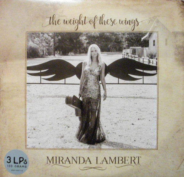 the weight of these wings (3lp-mint)